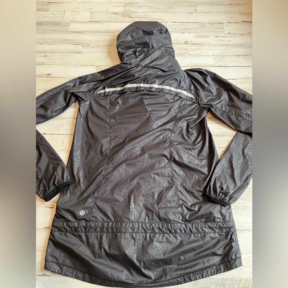 Black snakeskin rain jacket. Size 4. Barely worn.
